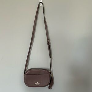 Brown Kate spade mini purse with tassel zipper
